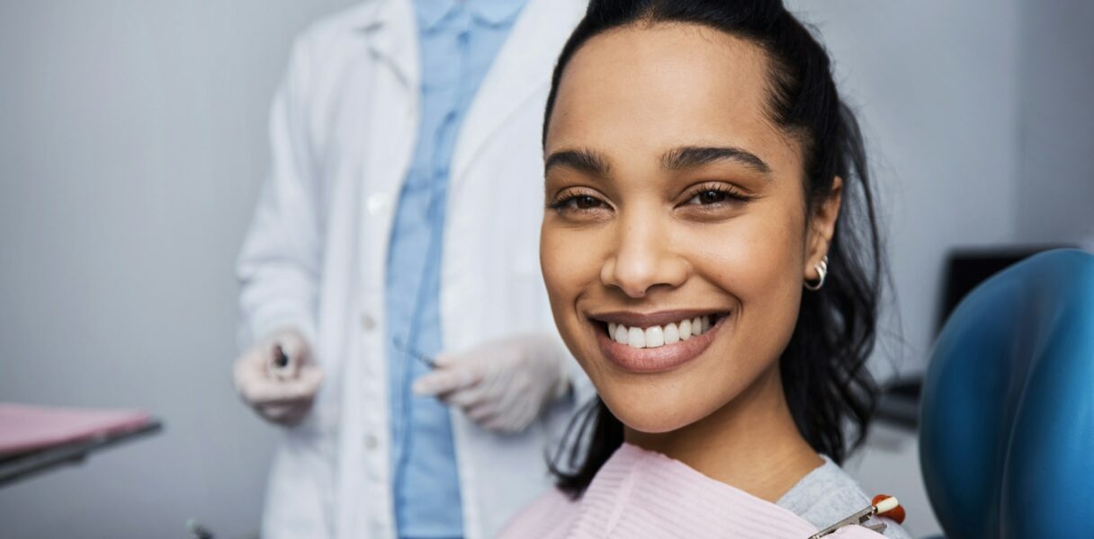 Portrait of a young woman having dental work done on her teeth